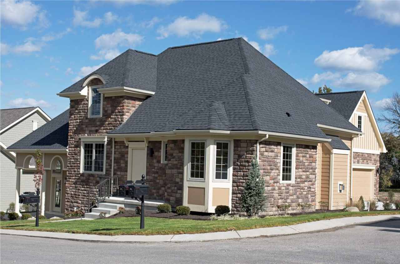 intact black roof on stone wall home